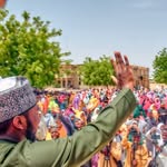 Ahmad Abdulaziz Yari waving to supporters at a public gathering